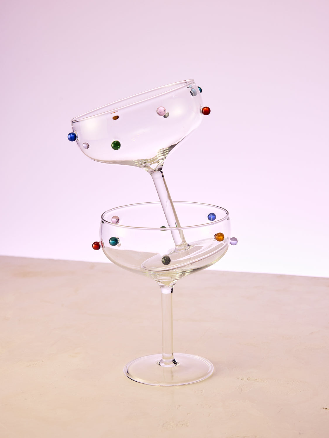 A pair of multicolor Dot Coupes stacked on top of each other.