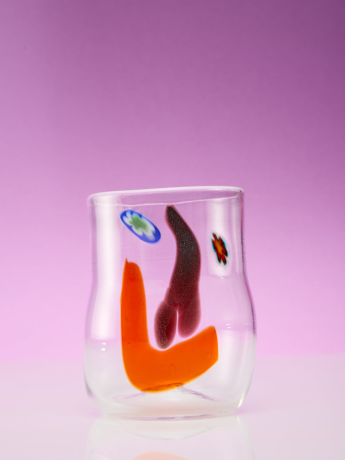 A single face vessel glass cup.