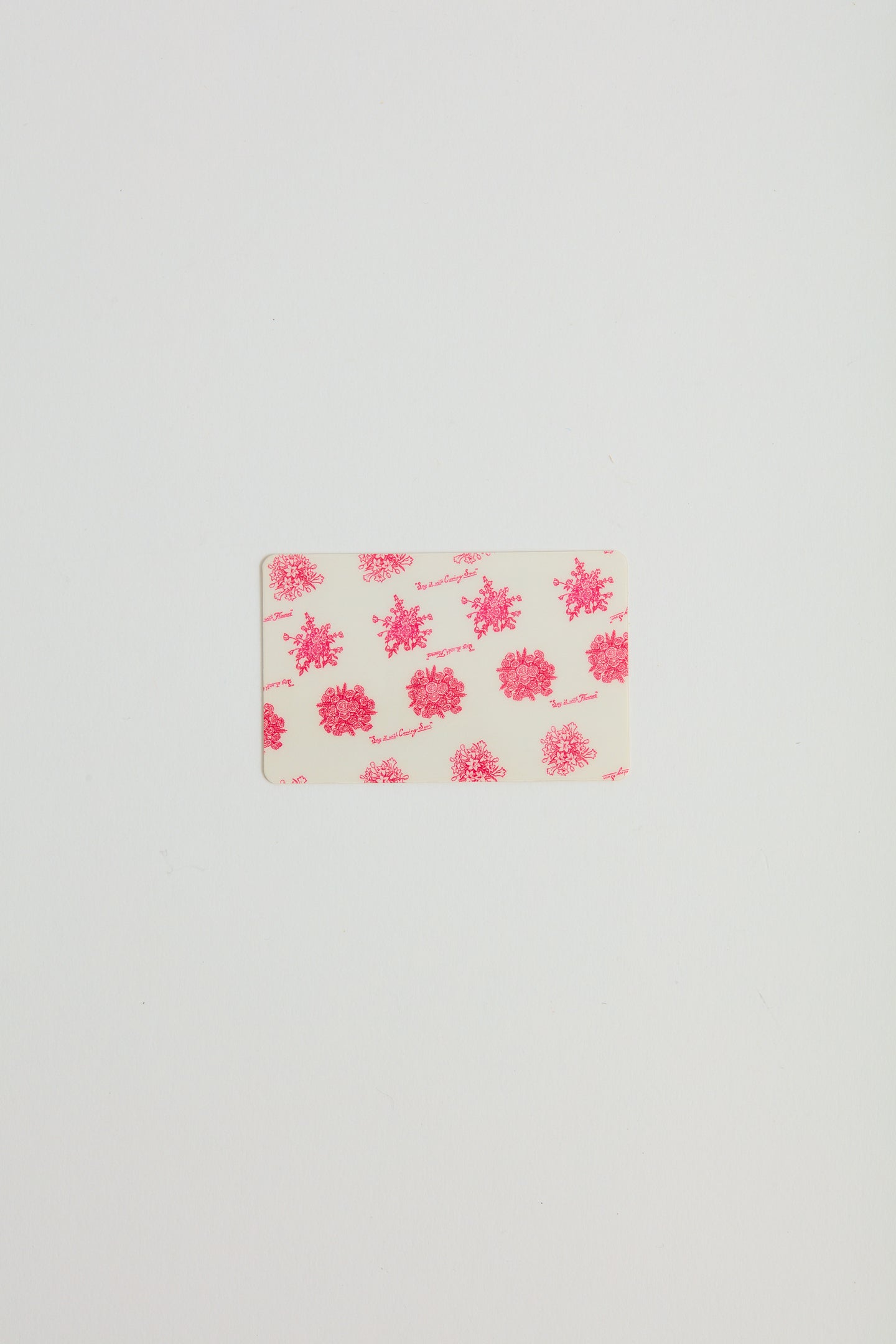 A prink floral printed gift card.