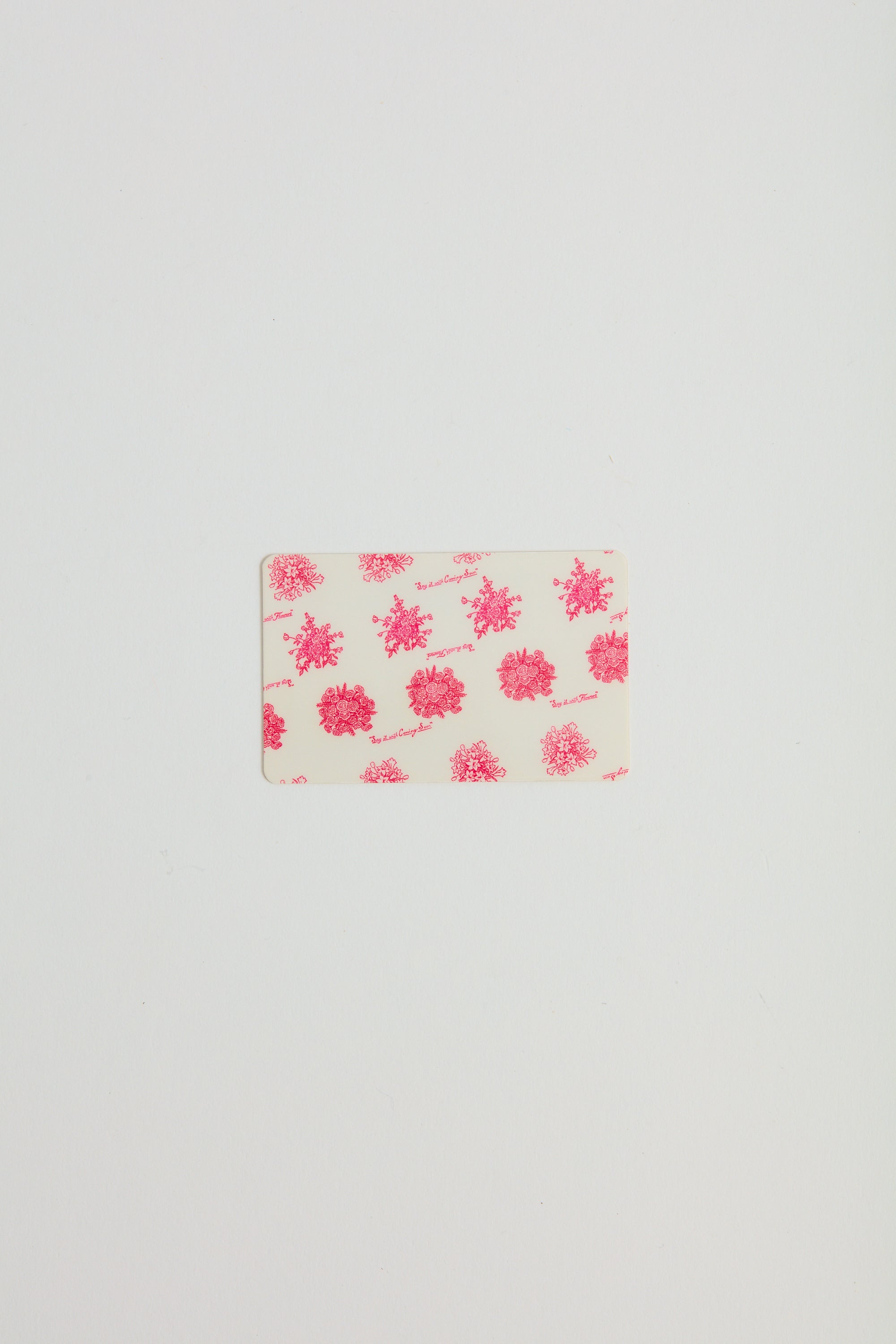 A prink floral printed gift card.