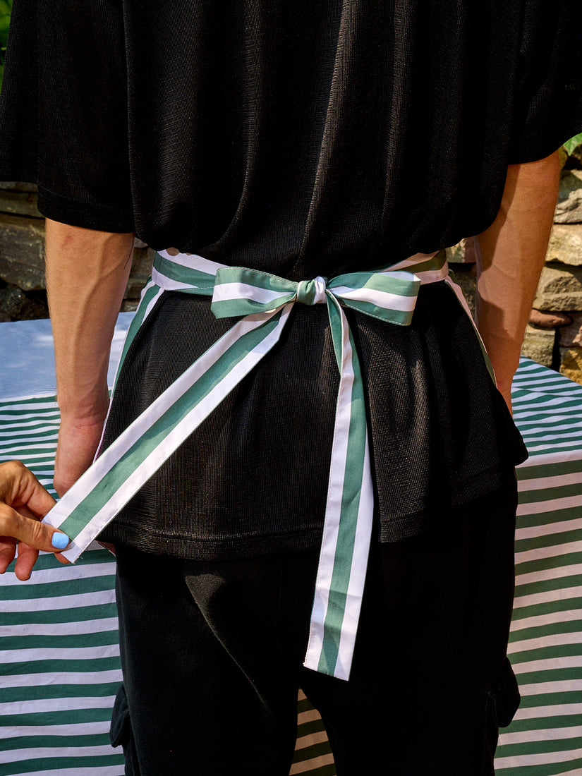 The Striped and Scalloped Apron by Gohar World tied in a bow.