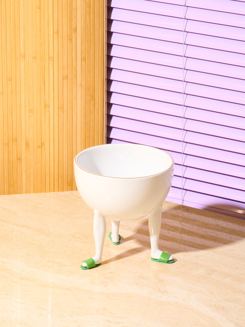 Leg Bowl by Chen Chen and Kai Williams with green slide slippers.