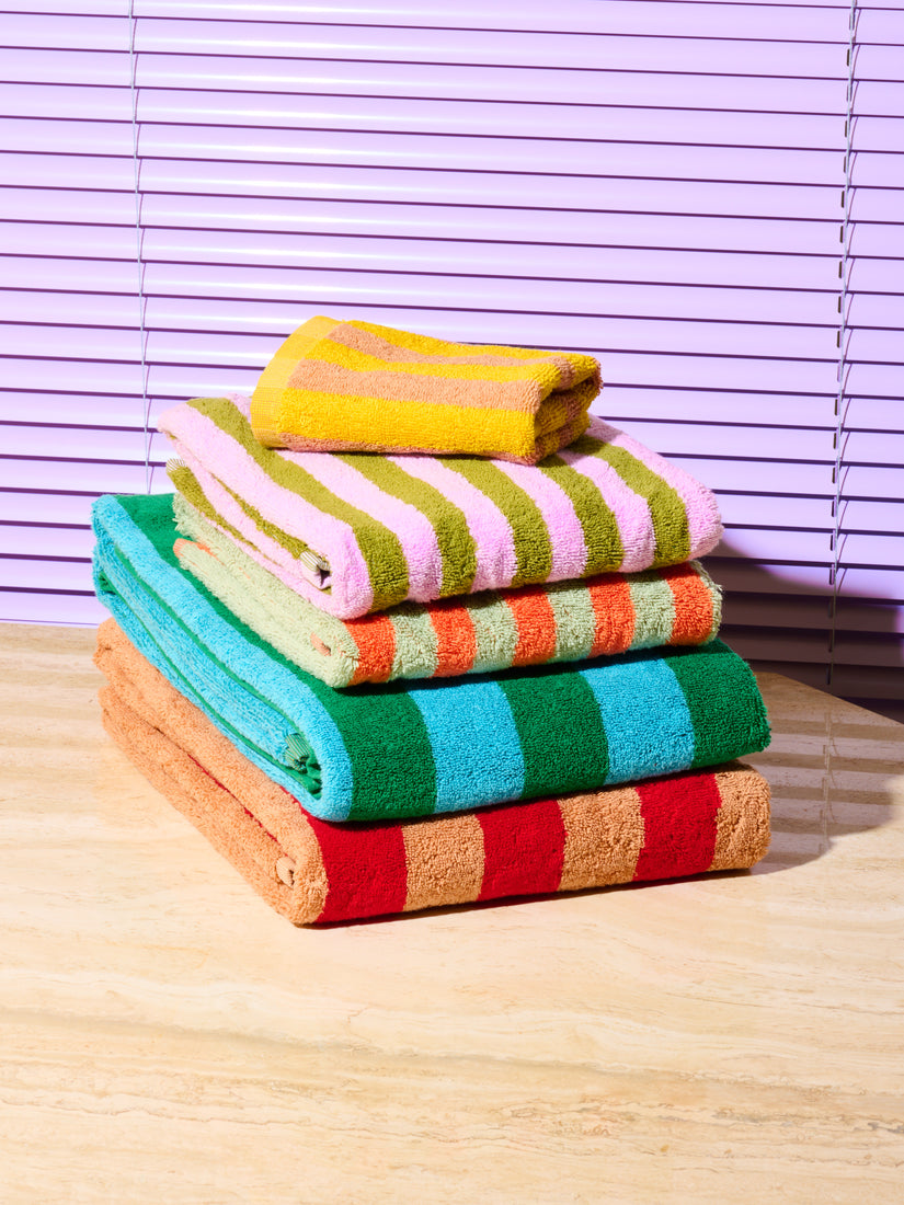 Neatly folded and stacked set of 5 Earth Stripe Bath and Hand Towels by Dusen Dusen.