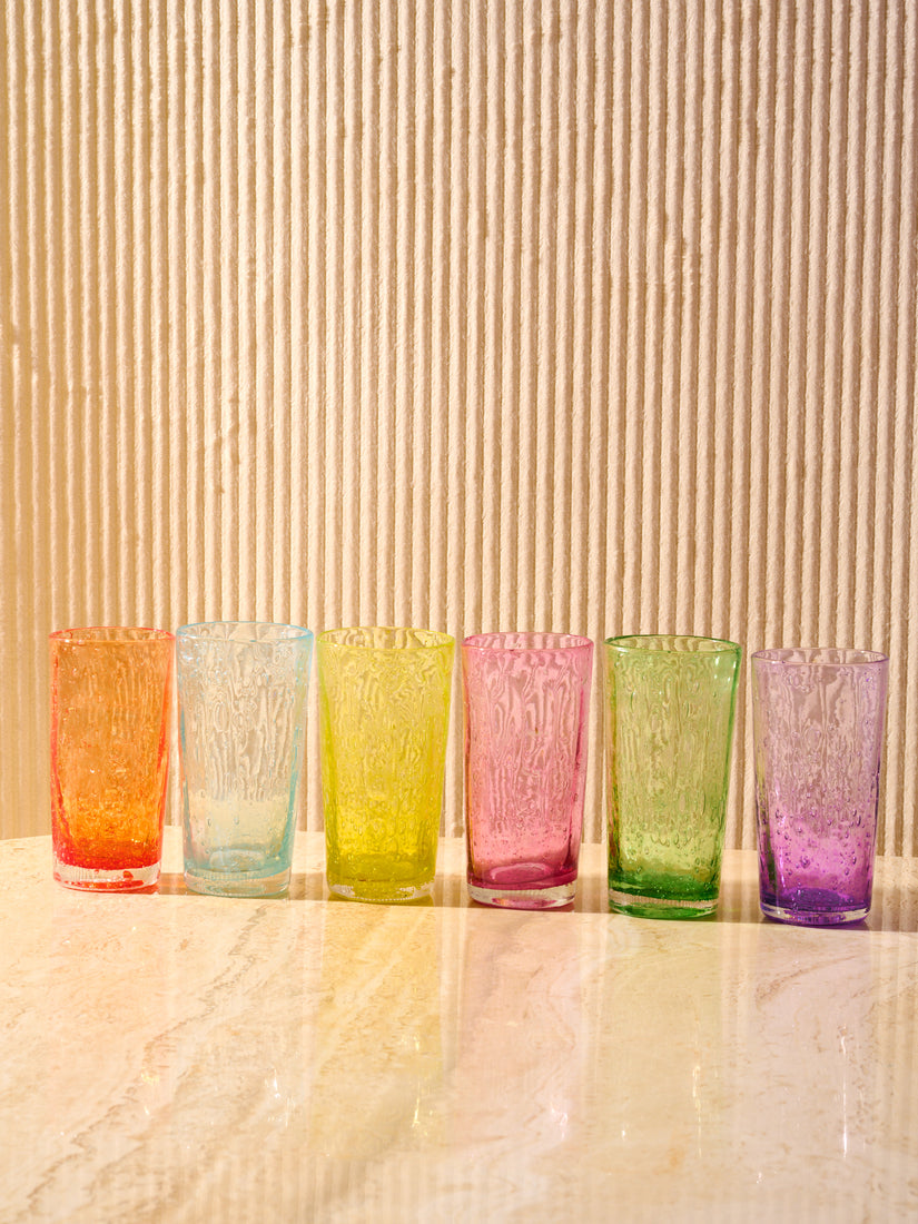 Orangeade Glasses in orange, blue, yellow, pink, green, and purple from left to right.