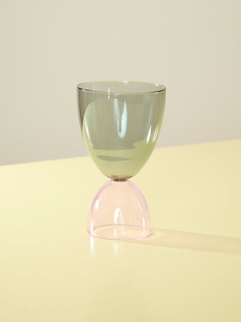 A smoke top and pink bottom cocktail glass.