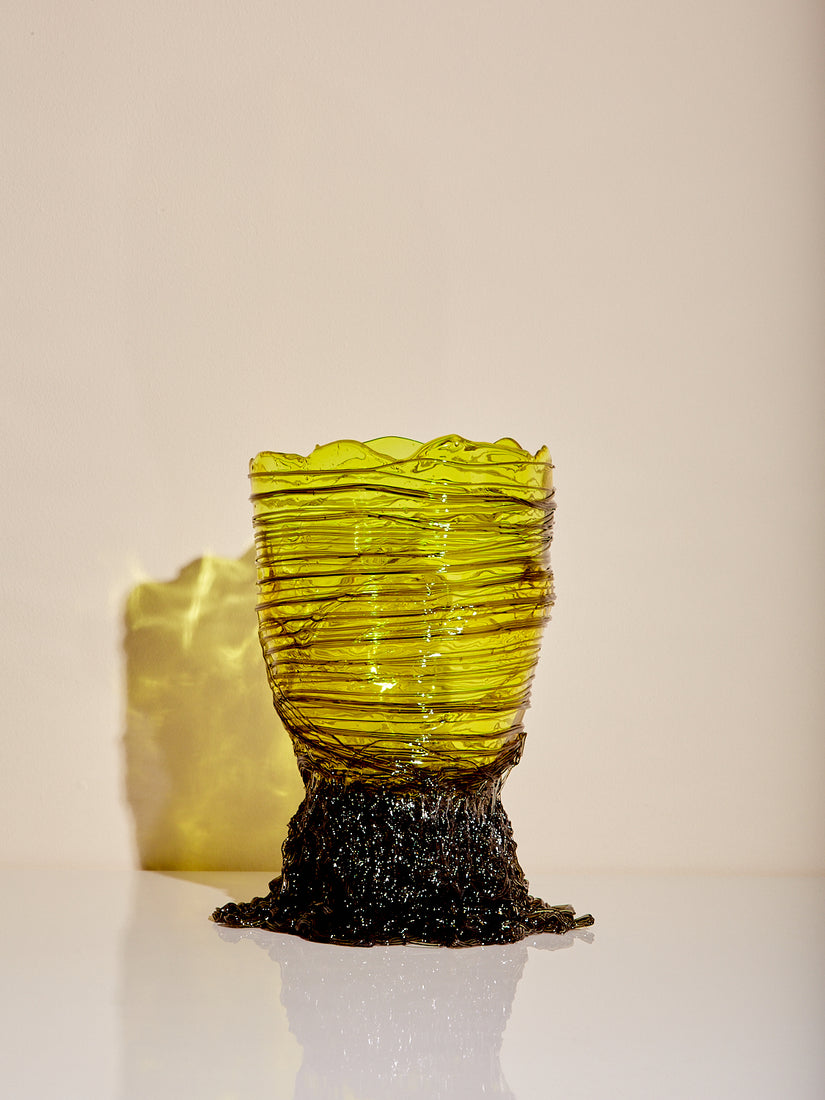 Spaghetti Vessel in bright green with strands of "spaghetti" in darker green wrapped around and piled to create a base.