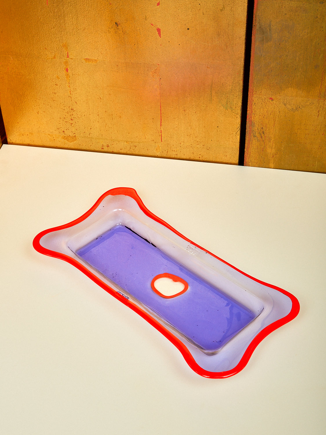 A rectangular lilac and red orange resin tray.