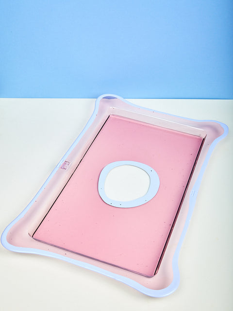 A rectangular pink and lavender resin tray.