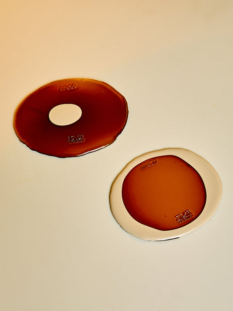 A pair of brown and champagne Table-Mates.