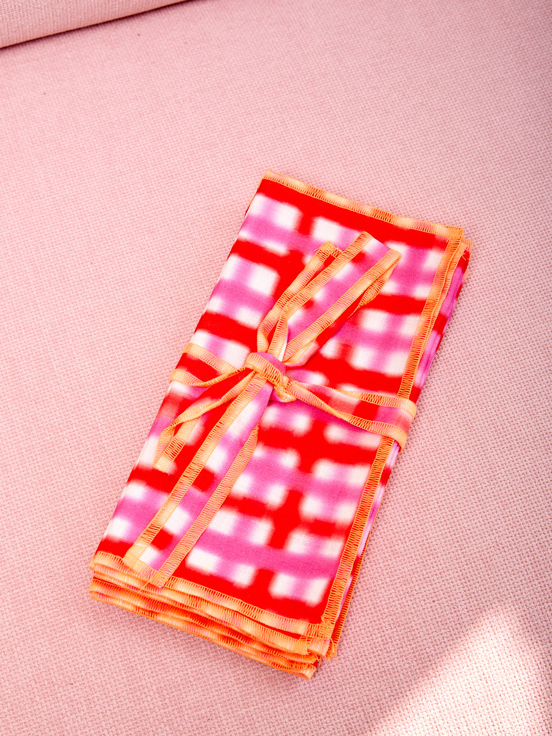 Pink and orange airbrushed napkins by Hotel Elma.