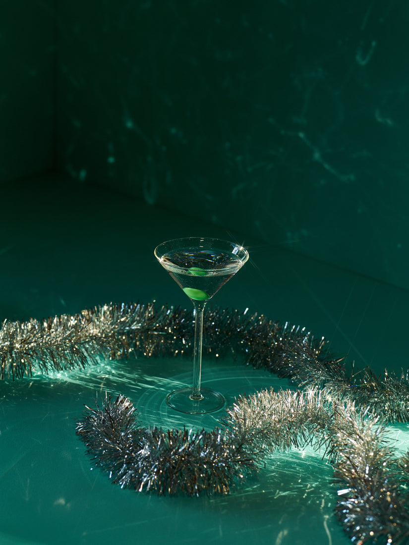 Silver tinsel surrounds a Martini Glass by Maison Balzac.