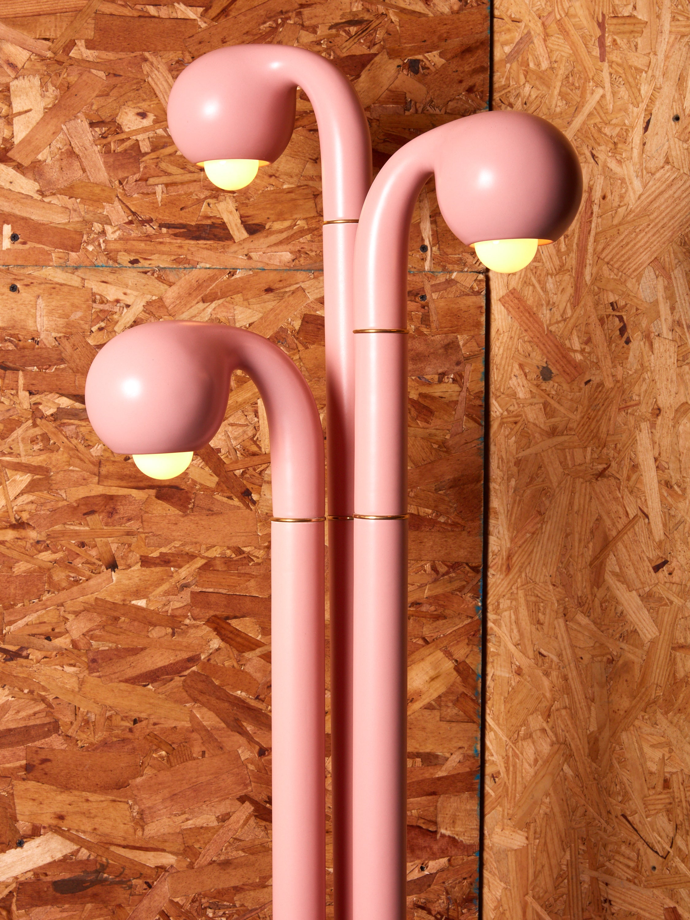 Close up of the 3 globes of an Entler ceramic floor lamp.