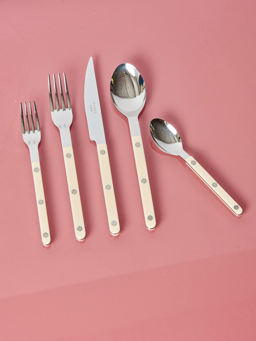 Ivory salad fork, dinner fork, dinner knife, dinner spoon, and teaspoon by Sabre.