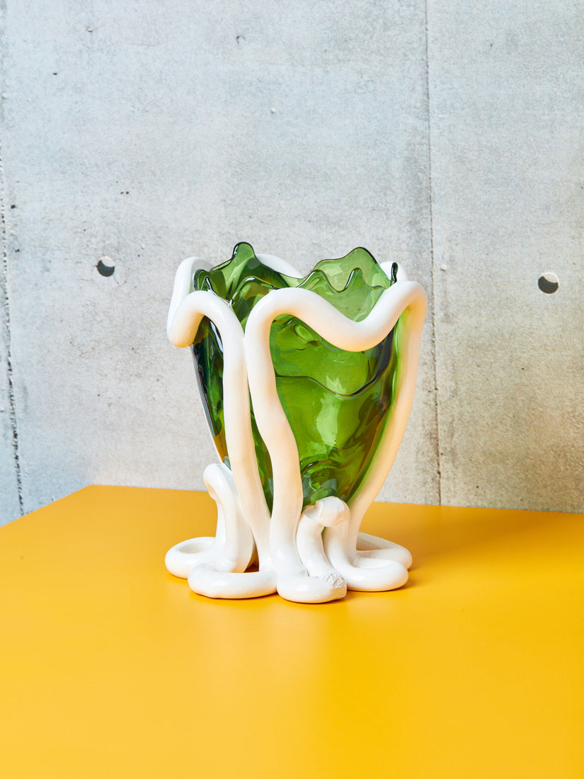 Transparent green resin vessel with thick piping-like design in opaque white resin.