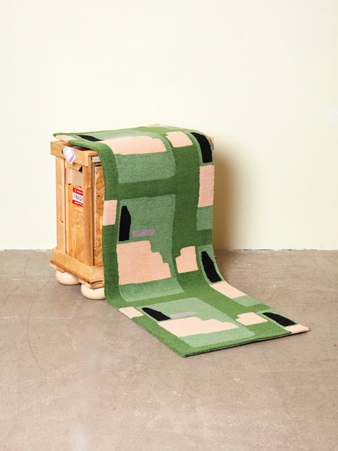 A Purple Noon runner draped over a crate.