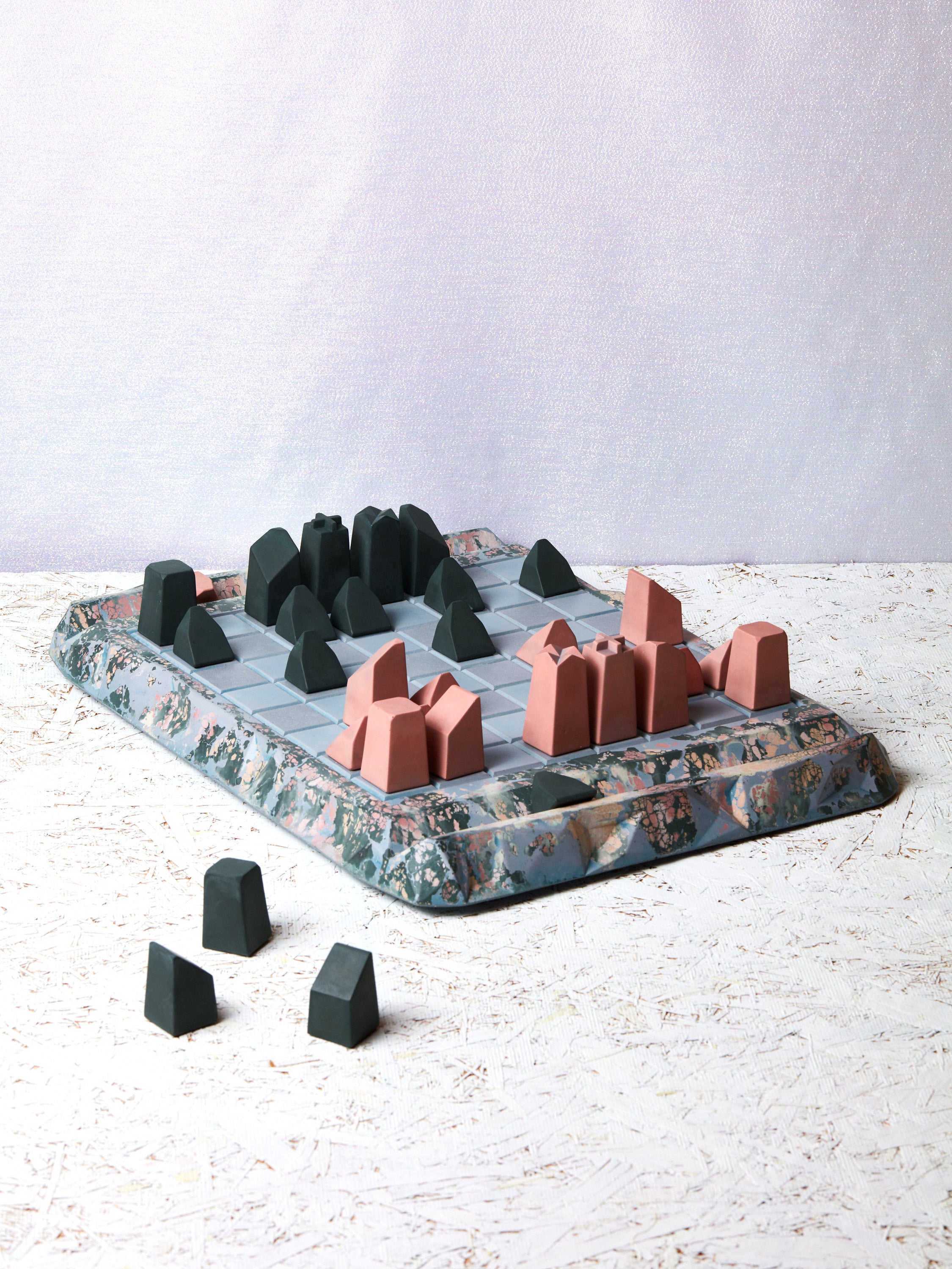Concrete Cat Chess Set with some pieces moved in play.
