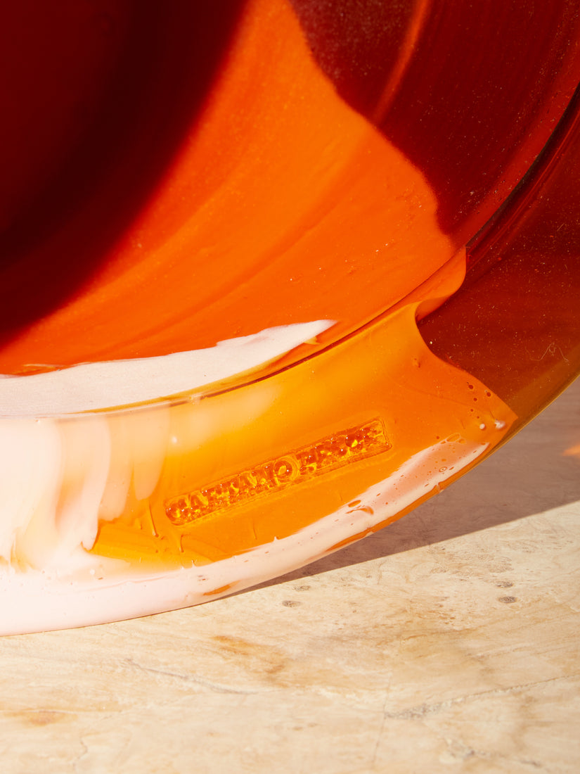 Close up of the embossed Gaetano Pesce logo on the lip of the Babel Ice Bucket.