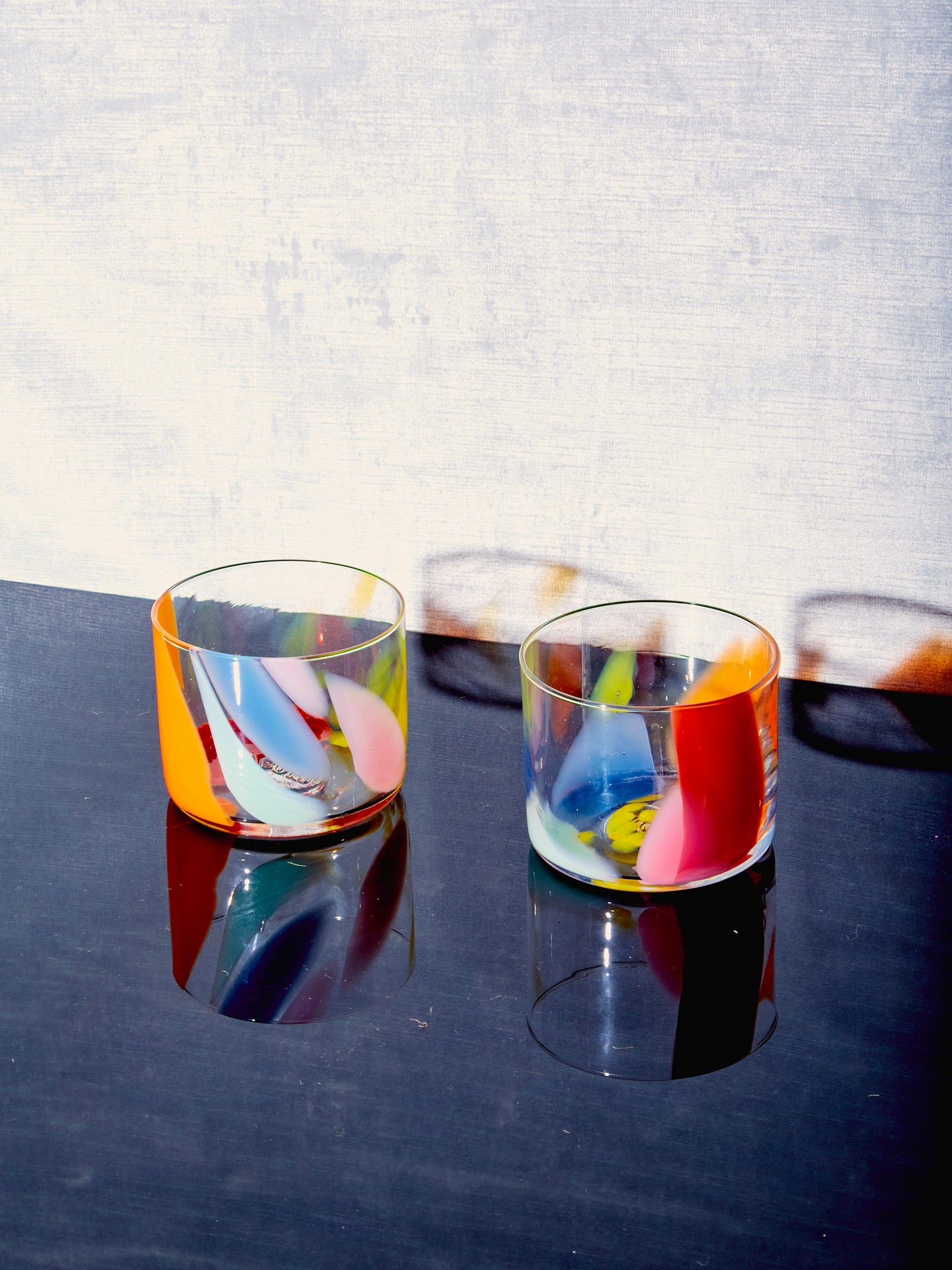 A pair of Rainbow Splash Cups by Bow Glass.
