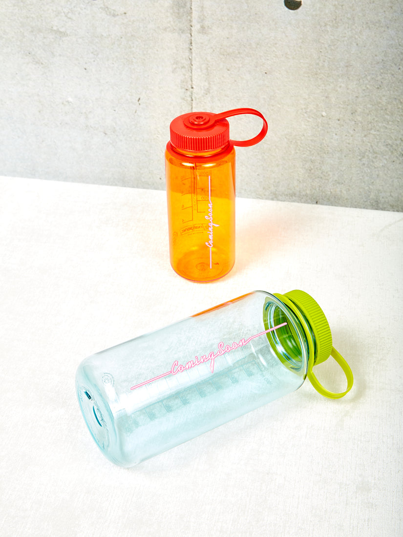 Seafoam and orange Nalgene water bottles with Coming Soon logo.