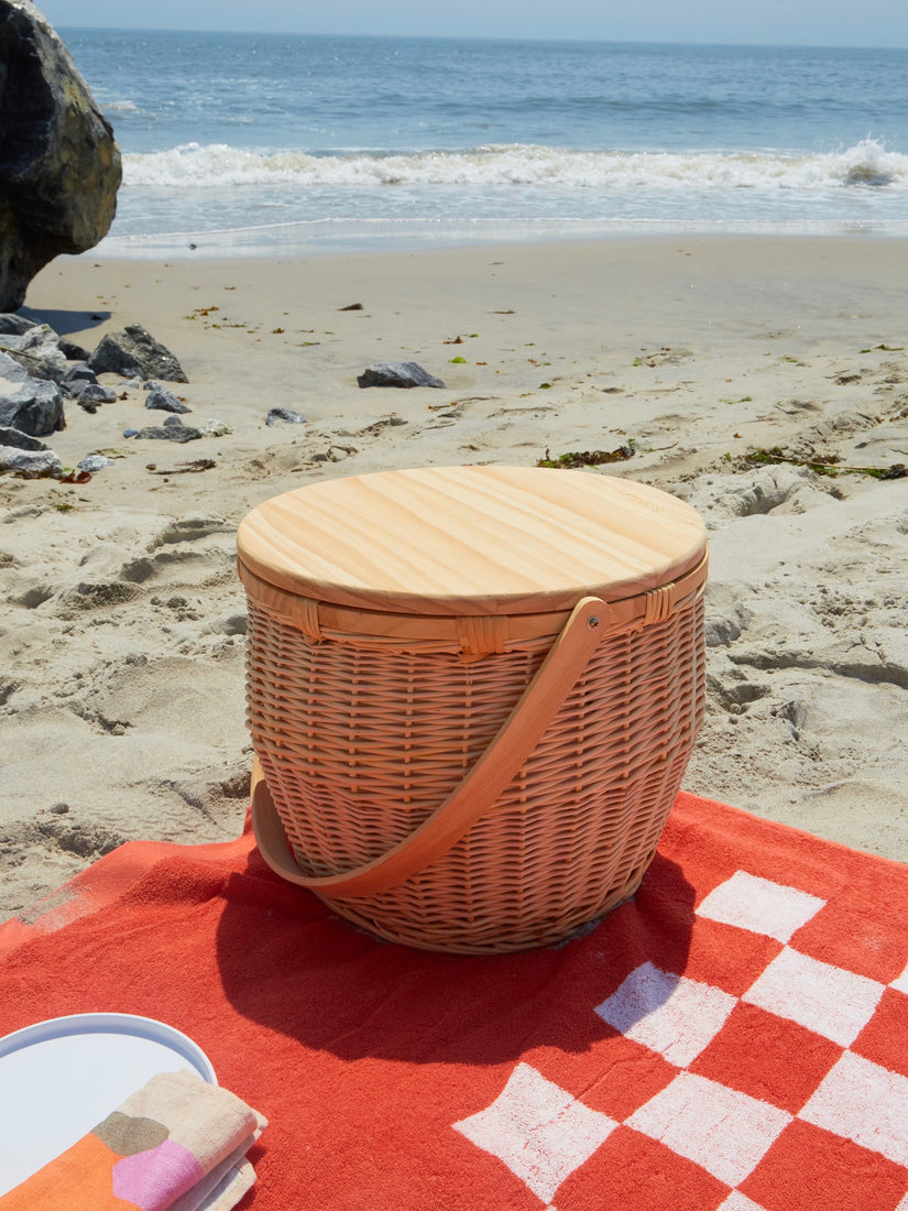 The Picnic Cooler Basket by Sunnylife on the beach.