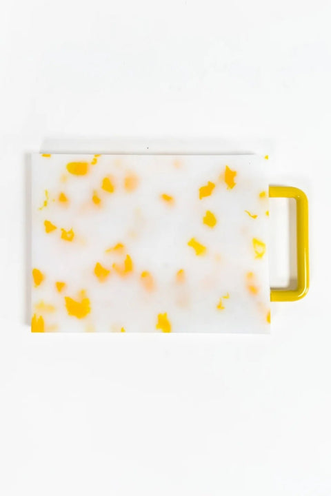 Yellow and white small chopping block by Fredericks and Mae.