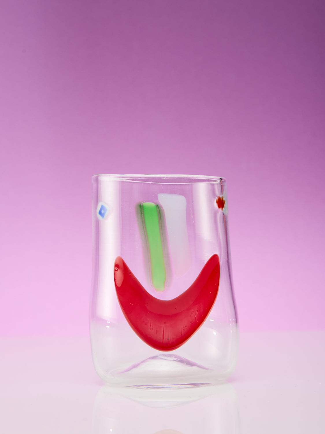 A single face vessel glass cup.