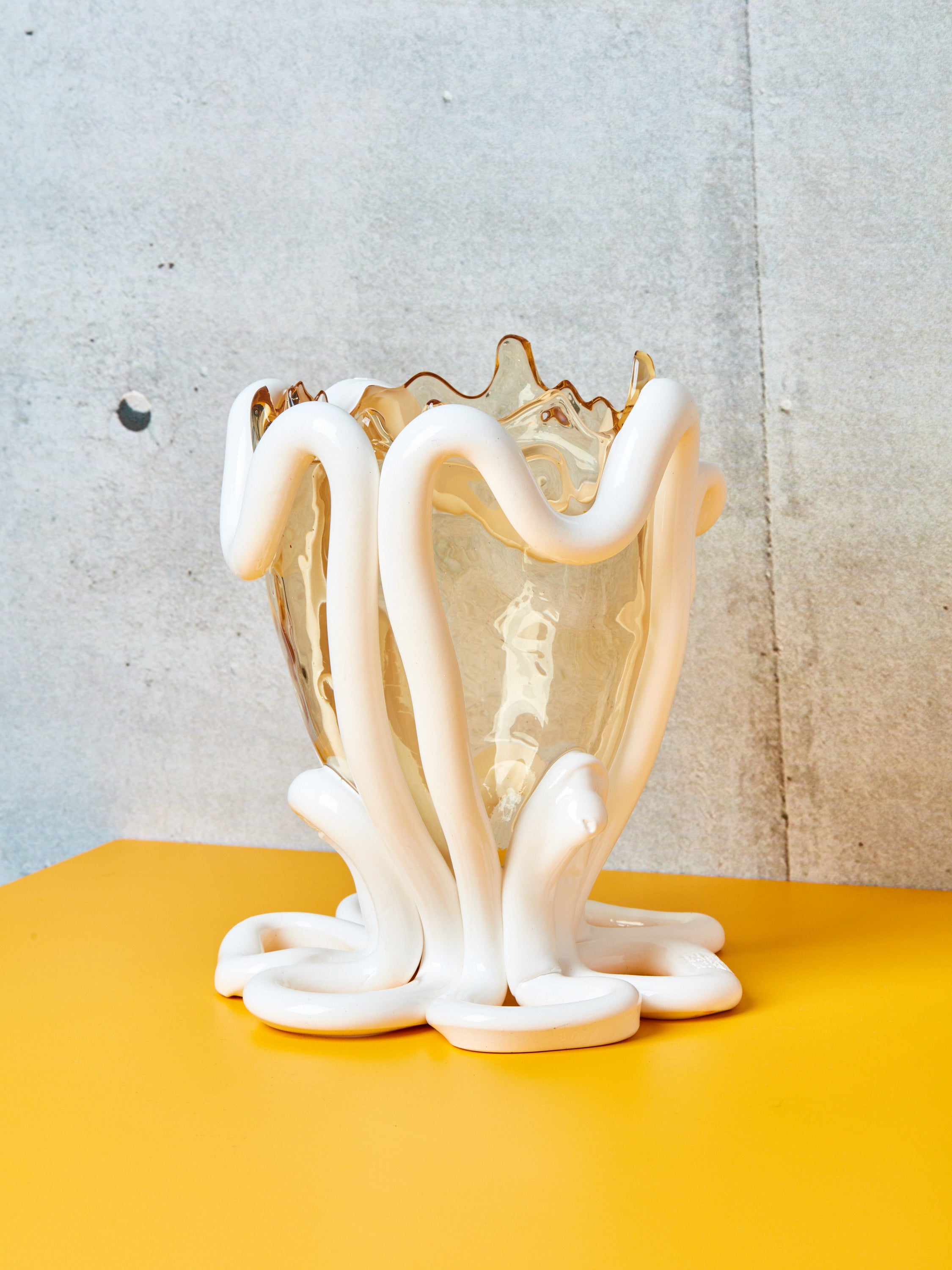 Indian Summer Vessel by Gaetano Pesce for Fish Design on a yellow surface.