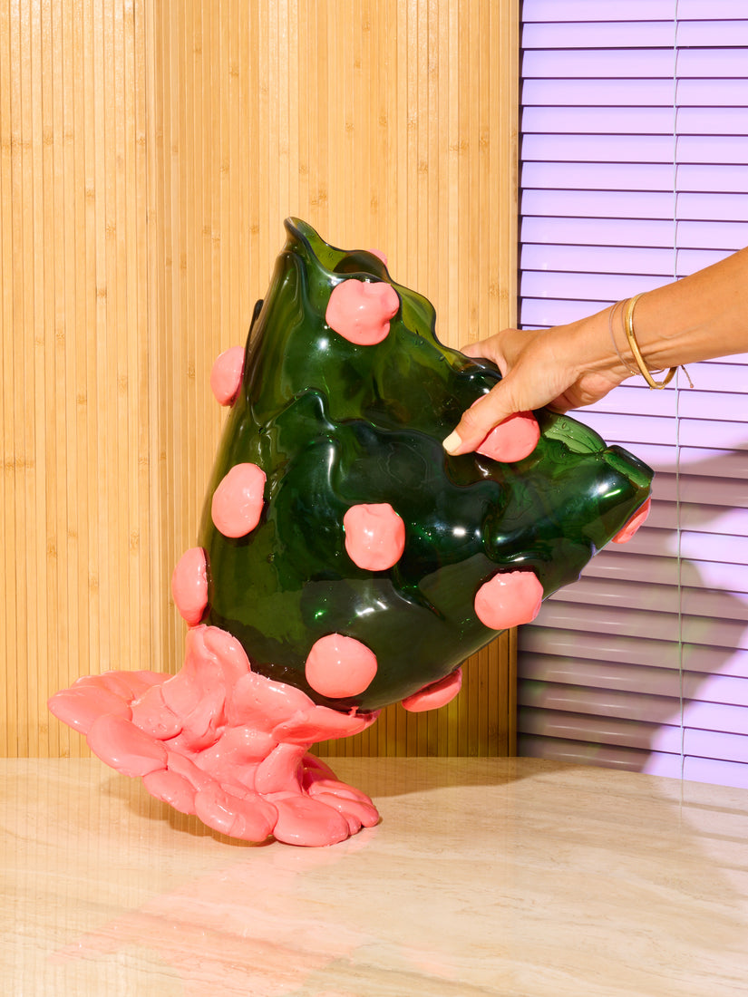 A hand squeezes the malleable Nugget Vessel by Gaetano Pesce for Fish Design.