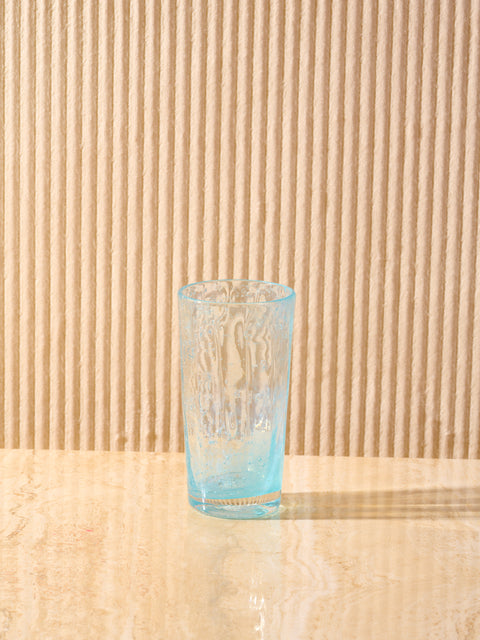 The Orangeade Glass in Blue by La Romaine Editions.