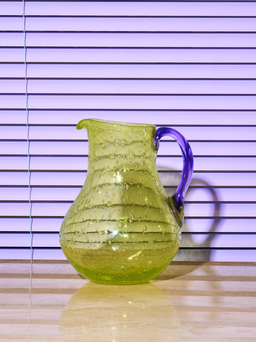 Bubble Glass Jug by La Romaine Editions in green with purple handle.