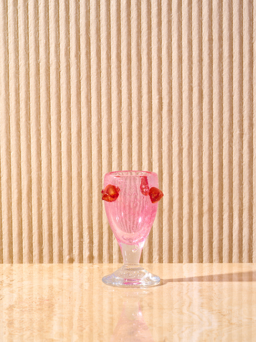 The Egg Cup by La Romaine Editions in pink and red.