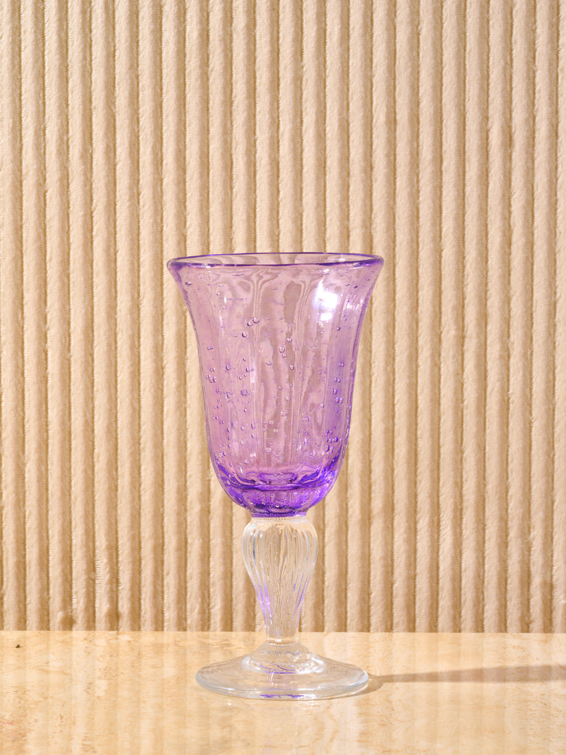A purple Bubbled Wine Glass by La Romaine Editions.