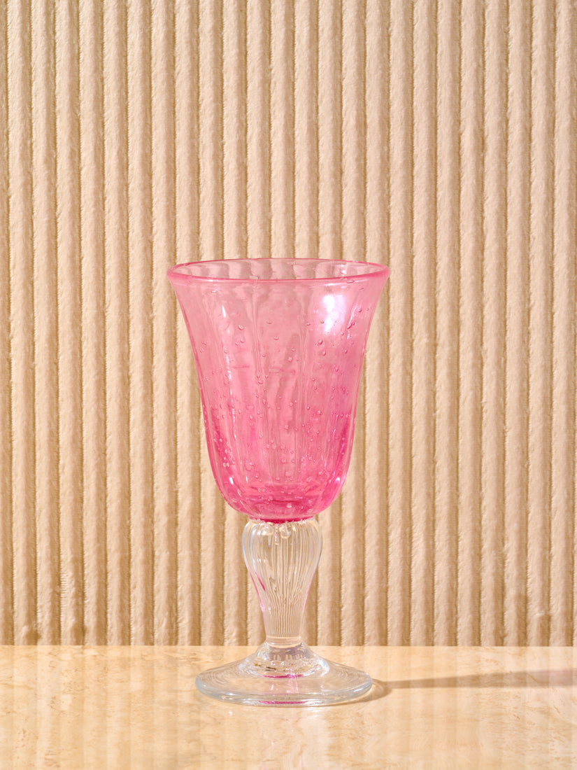 A pink Bubbled Wine Glass by La Romaine Editions.