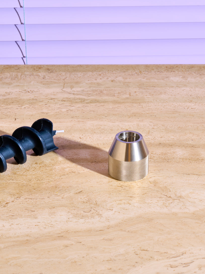 Stainless steel drill bit candle holder by 54 Celcius.