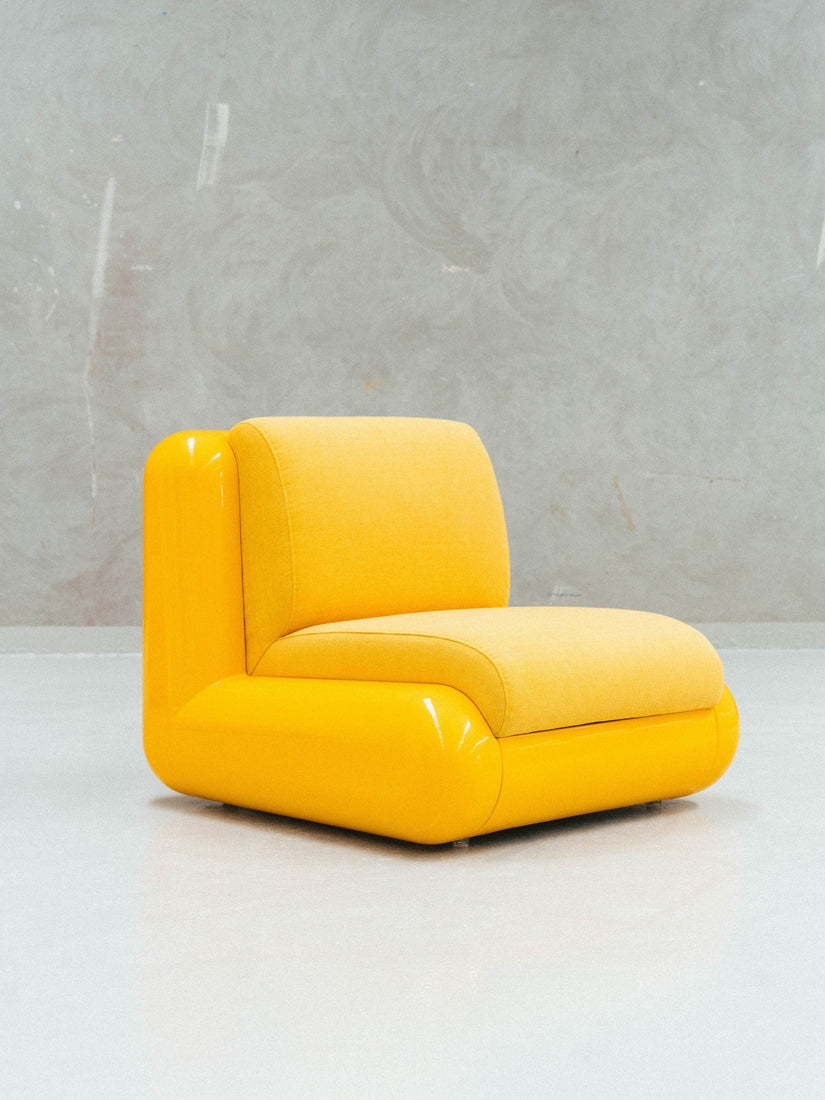 A yellow T4 Modular Seating Chair by Uma.