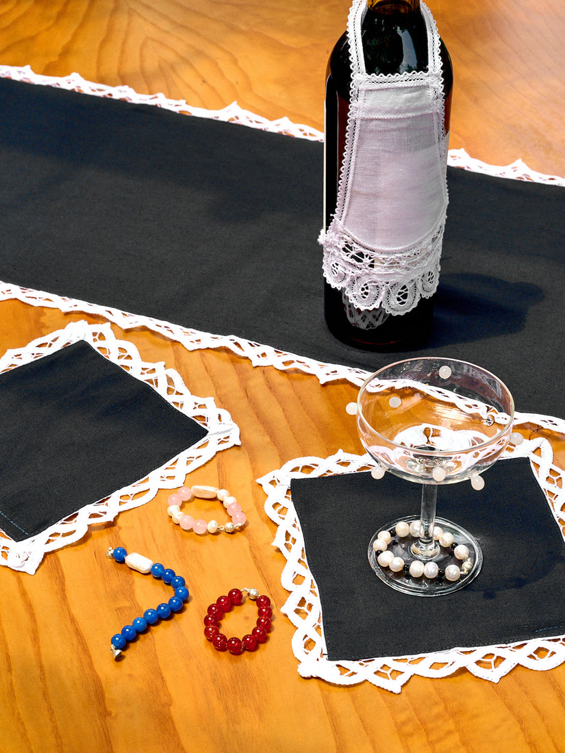 Lace Trim Cocktail Napkins and Table Runner on a wooden table.