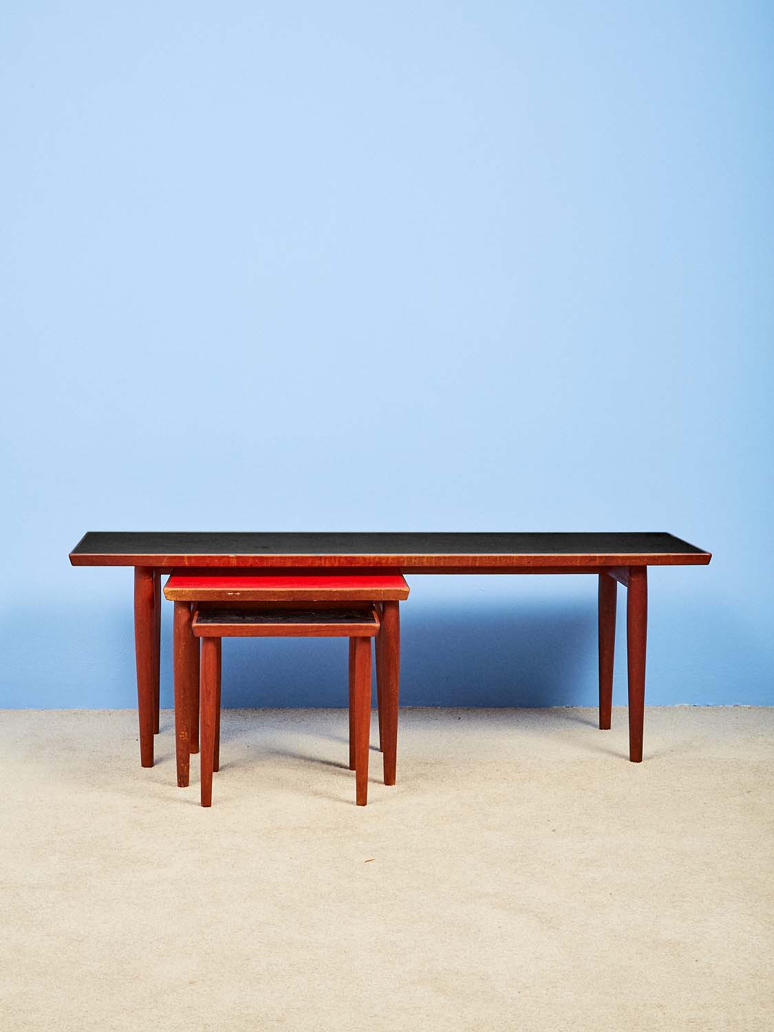 Vintage Nesting Coffee Tables made of wood with laminate tops.