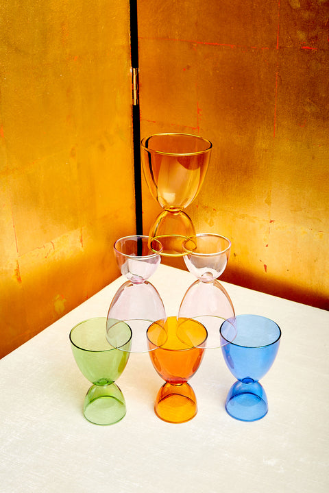 A pyramid of Mamo's cocktail glasses in 6 different monotone colorways.