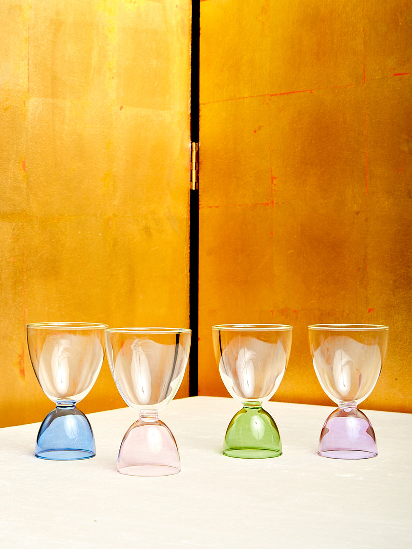 The Classic Set of Cocktail Glasses by Mamo in blue, pink, green, and lavender, all with clear tops.