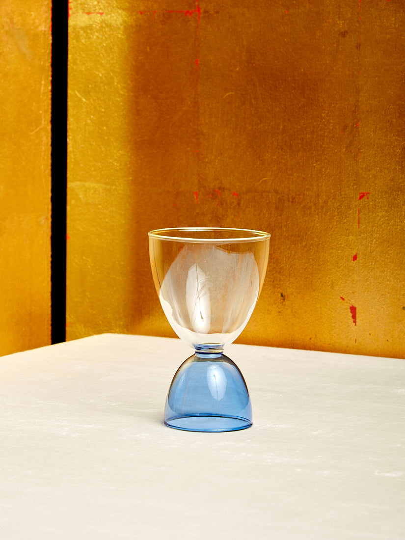 A single clear top blue bottom Cocktail Glass by Mamo.