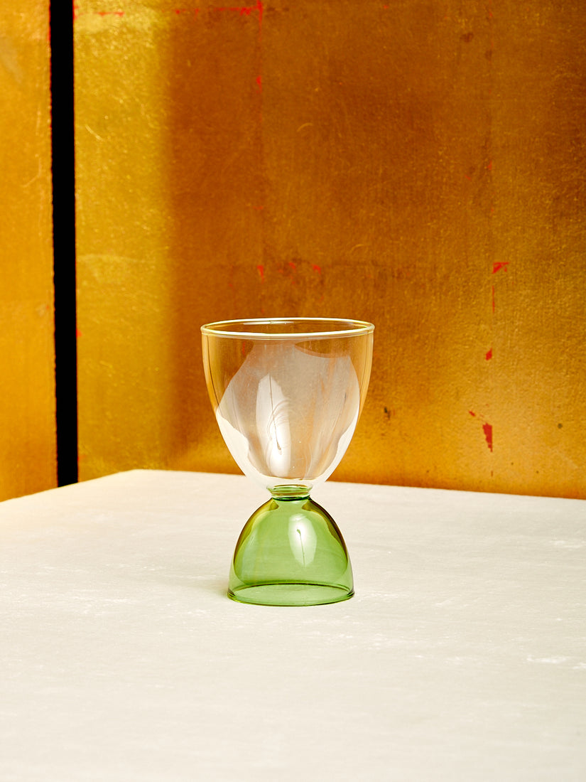 A single clear top green bottom Cocktail Glass by Mamo.