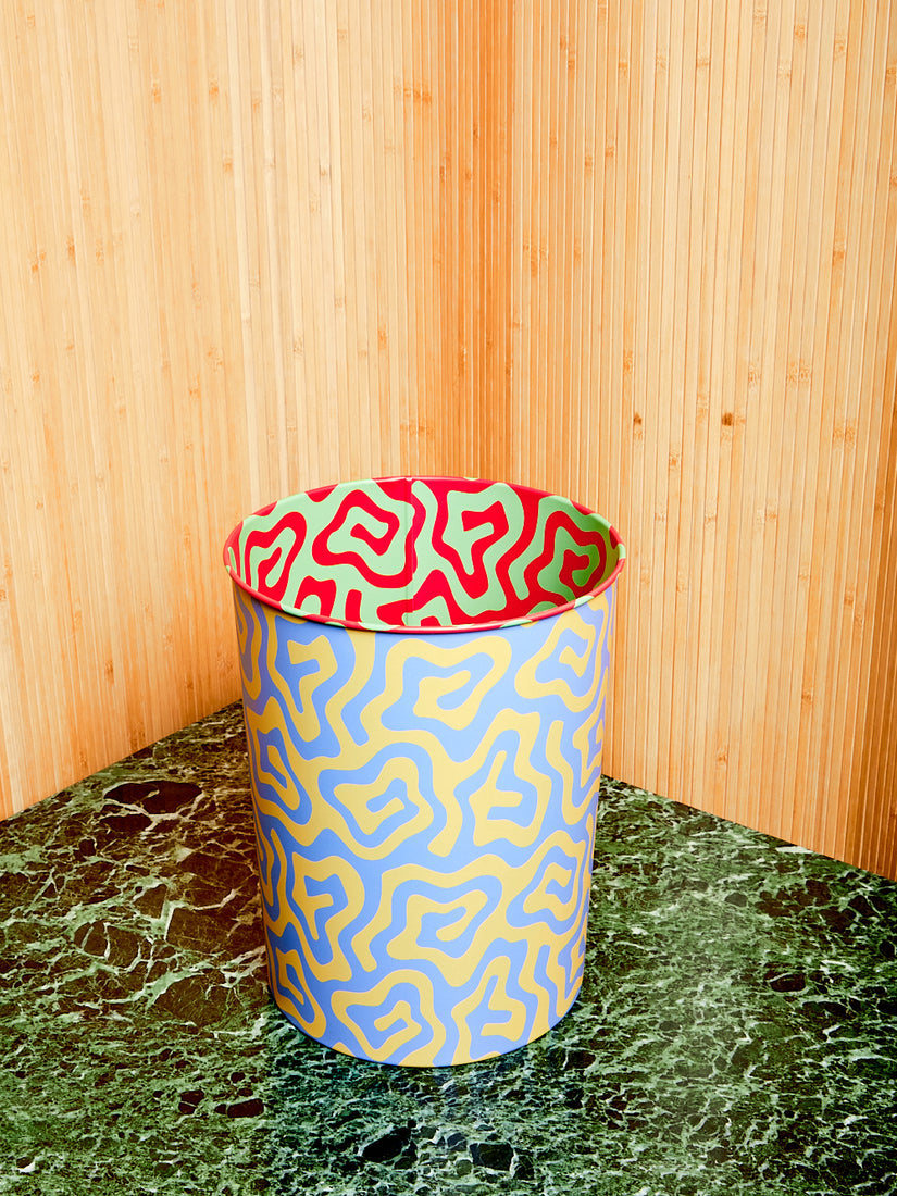 The spiral pattern bin with yellow and blue exterior, red and mint green interior.