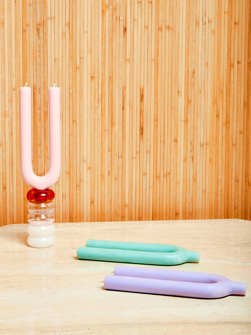 Three Duet Candles by Maison Balzac in lavender, mint, and pink. The pink candle sits inside a grande Pauline candle holder.