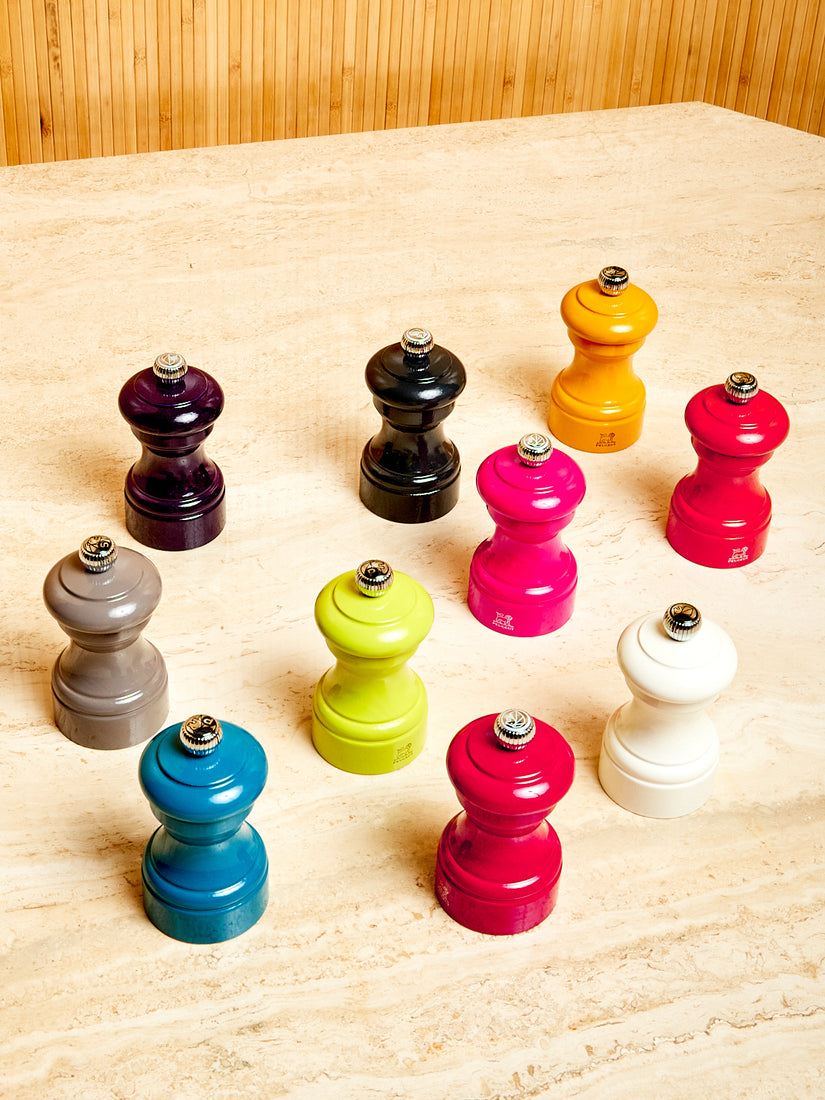 Salt and Pepper Mills by Peugeot in various colors.