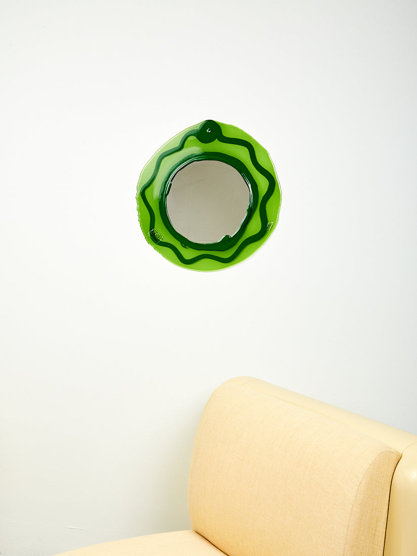 Handmade resin mirror with transparent olive green and opaque hunter green swirl.