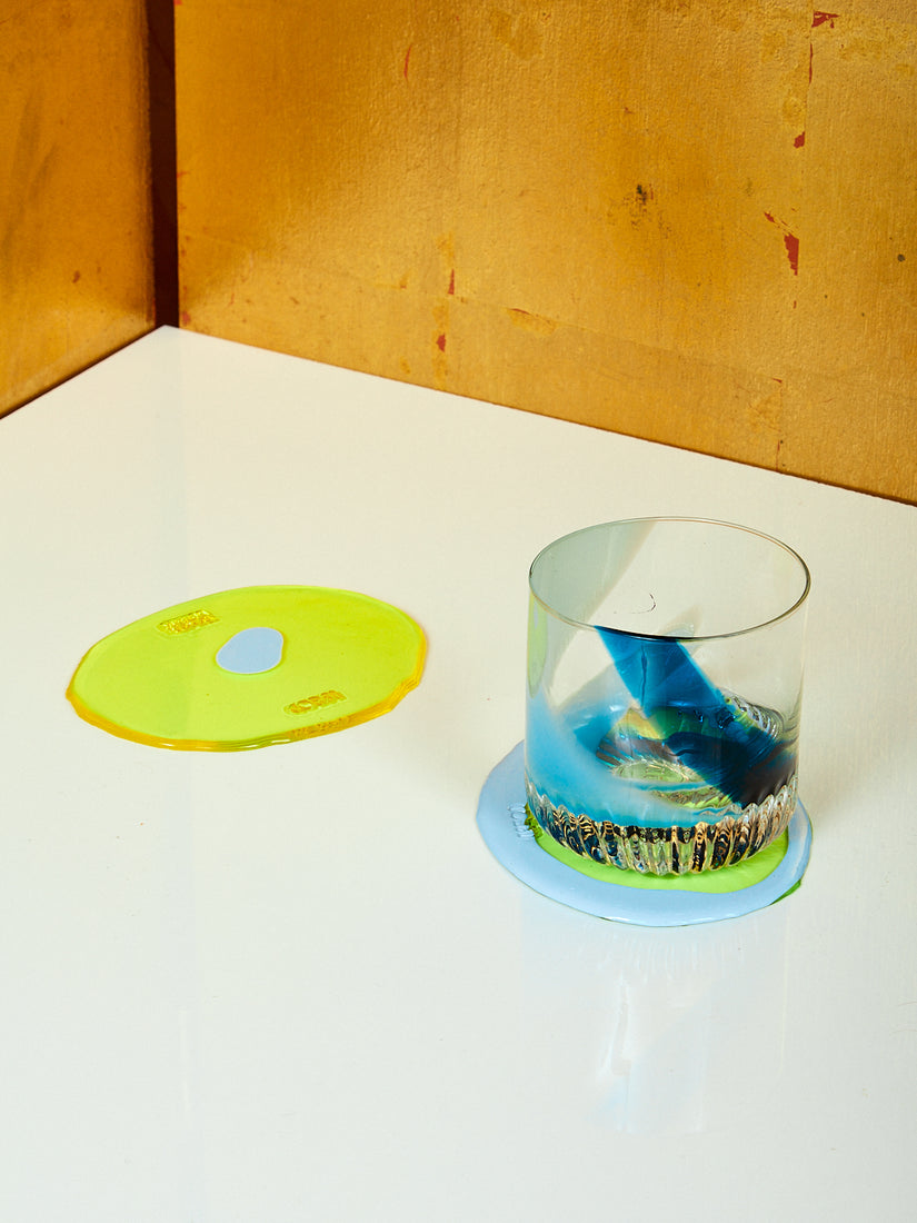A pair of Yellow and Blue Table-Mates with a single Rocks Glass by Bow Glass.