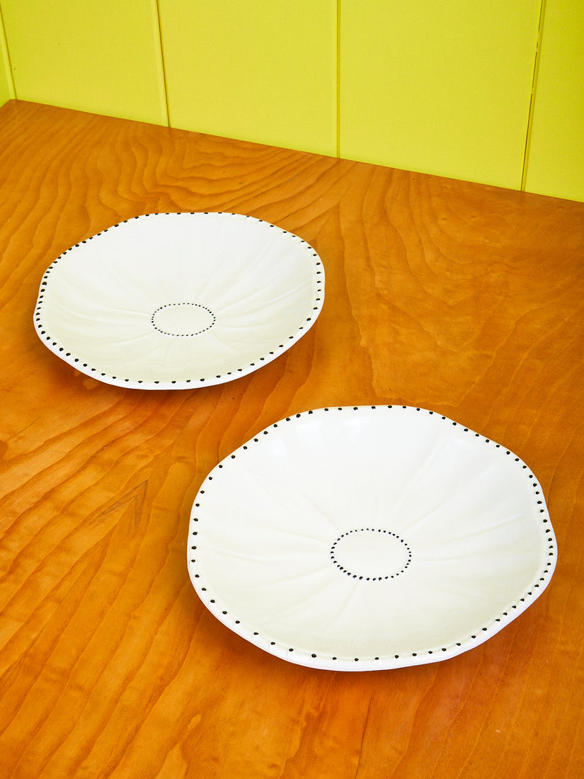 A pair of Poppy Dinner Plates by La Romaine Editions.