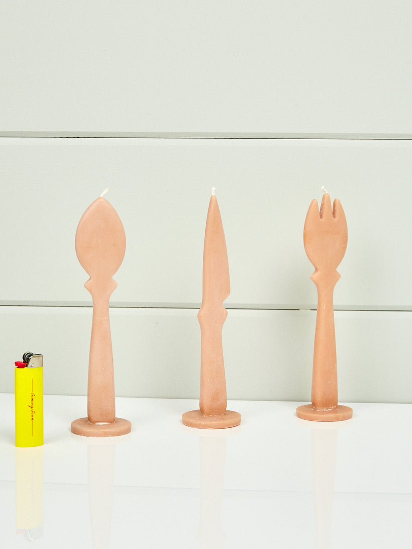 Tromp L'oeil Cutlery Set Candles by Maison Balzac next to a yellow Coming Soon lighter.