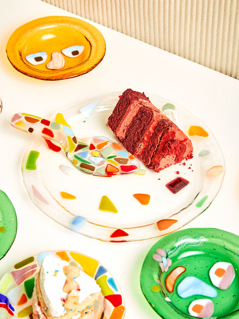 A white table featuring the Confetti Cake Server and Plate, and various Lawn Bowls.