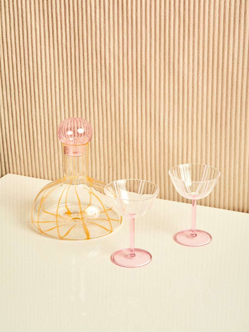 A pair of pink Grand Soleil Coupes and a Grand Soleil wine decanter by Maison Balzac.